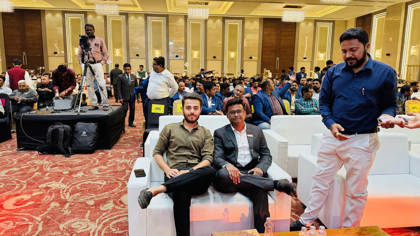 Seated among industry colleagues at an event